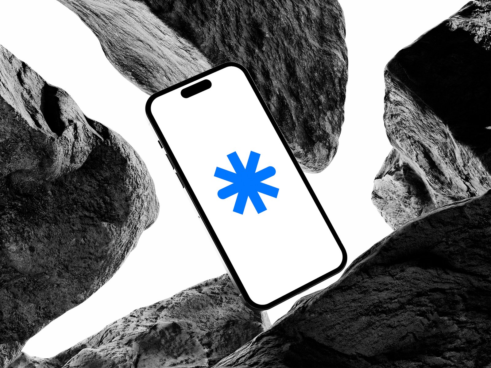 Celular exibindo o símbolo da Astter, cercado por rochas em preto e branco